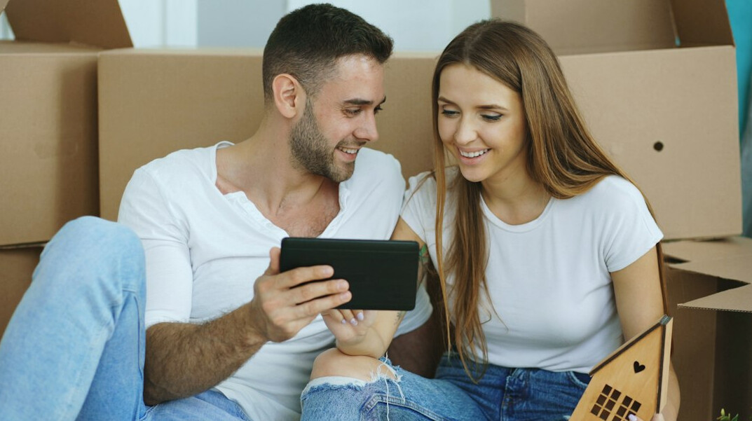happy couple reviewing savings